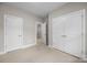 Empty bedroom with a walk-in closet and double doors at 4008 Leyland Ct, Mint Hill, NC 28227