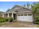Charming home featuring stone accents, a two-car garage, and well-maintained landscaping at 4008 Leyland Ct, Mint Hill, NC 28227