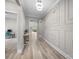 Hallway with decorative wall paneling leads to office and main living area at 4008 Leyland Ct, Mint Hill, NC 28227