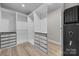 Spacious walk-in closet with custom shelving and drawers for optimal organization at 4008 Leyland Ct, Mint Hill, NC 28227