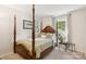 Bedroom with four poster bed frame, large window and natural light at 405 Scarborough Ln, Matthews, NC 28105