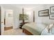 Bedroom with four poster bed frame, large window and television at 405 Scarborough Ln, Matthews, NC 28105