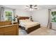 Bright bedroom with a large bed, ceiling fan, and neutral decor at 405 Scarborough Ln, Matthews, NC 28105