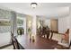 Bright dining room with hardwood floors, wallpaper and open access to the office and living room at 405 Scarborough Ln, Matthews, NC 28105