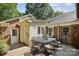 Outdoor patio featuring a brick floor and a metal dining set perfect for entertaining guests at 405 Scarborough Ln, Matthews, NC 28105