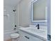 Modern bathroom with subway tile, a sleek vanity, and matte black fixtures at 418 Harrison St, Statesville, NC 28677