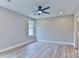 Bright and spacious bedroom with a modern ceiling fan, wood-look floors, and recessed lighting at 418 Harrison St, Statesville, NC 28677