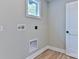 Bright laundry room with a small window and modern fixtures at 418 Harrison St, Statesville, NC 28677