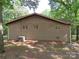Exterior shot of a single-story brick home featuring windows and an AC unit at 4476 Nc Hwy 200 Rd, Stanfield, NC 28163