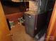 View of the furnace, showing the mechanicals of the home at 4476 Nc Hwy 200 Rd, Stanfield, NC 28163