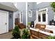 Charming backyard showcasing a patio with cozy seating, surrounded by lush landscaping at 4516 Night Heron Ln, Charlotte, NC 28211