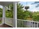 This is a view from the balcony showing lush trees and landscaping at 4516 Night Heron Ln, Charlotte, NC 28211