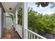 A nice view from the balcony showcasing lush trees and landscaping at 4516 Night Heron Ln, Charlotte, NC 28211
