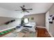 Bedroom with hardwood floors, unique window, and sporting equipment at 4516 Night Heron Ln, Charlotte, NC 28211