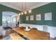 This dining room features an island view, wooden table, and stylish lighting at 4516 Night Heron Ln, Charlotte, NC 28211