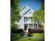 Charming two-story home boasts a welcoming front porch and well-manicured lawn at 4516 Night Heron Ln, Charlotte, NC 28211