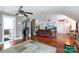 Spacious living room features hardwood floors, ceiling fan, stylish decor, and entertainment area at 4516 Night Heron Ln, Charlotte, NC 28211