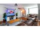 Cozy bonus room with TV and built in bar area for entertaining at 4516 Night Heron Ln, Charlotte, NC 28211