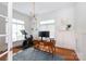 Bright home office featuring hardwood floors, stylish lighting, and ample workspace at 4516 Night Heron Ln, Charlotte, NC 28211