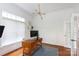 Bright home office featuring hardwood floors, stylish lighting, and ample workspace at 4516 Night Heron Ln, Charlotte, NC 28211