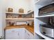 Well-organized pantry with wood countertops, white cabinets, and ample storage shelves at 4516 Night Heron Ln, Charlotte, NC 28211