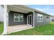 Back patio with neutral siding, white trim and a small grassy area at 4619 Harris Elliot Rd, Lincolnton, NC 28092