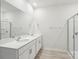Bright bathroom with double sinks, quartz counters, and glass shower, offering a spa-like experience at 4619 Harris Elliot Rd, Lincolnton, NC 28092