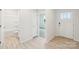 Bathroom featuring light wood-look flooring, a shower-tub combo, and an open doorway at 4619 Harris Elliot Rd, Lincolnton, NC 28092