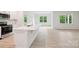 Modern kitchen featuring an island with white countertops, stainless steel appliances, and ample storage at 4619 Harris Elliot Rd, Lincolnton, NC 28092