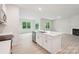 A modern kitchen with stainless steel appliances, an island with seating, and plenty of natural light at 4619 Harris Elliot Rd, Lincolnton, NC 28092
