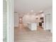 A bright, open kitchen featuring stainless steel appliances, white cabinets and a large kitchen island at 4619 Harris Elliot Rd, Lincolnton, NC 28092