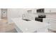 Kitchen island with white countertop, stainless steel sink and faucet, and white cabinets at 4619 Harris Elliot Rd, Lincolnton, NC 28092