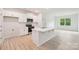 Modern kitchen featuring an island with white countertops, stainless steel appliances, and ample storage at 4619 Harris Elliot Rd, Lincolnton, NC 28092