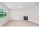 Bright living room featuring a fireplace, large window with natural light, and wood flooring at 4619 Harris Elliot Rd, Lincolnton, NC 28092