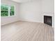 Cozy living room featuring a fireplace and a large window at 4619 Harris Elliot Rd, Lincolnton, NC 28092