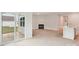 Open-concept living room with light wood floors, fireplace, and a sliding glass door to outdoor space at 4619 Harris Elliot Rd, Lincolnton, NC 28092