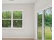 Bright living space featuring a large window and glass sliding doors with backyard views at 4619 Harris Elliot Rd, Lincolnton, NC 28092