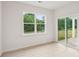 Bright living space featuring a large window and glass sliding doors with backyard views at 4619 Harris Elliot Rd, Lincolnton, NC 28092