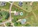 Aerial view of a property with a pool, beautiful landscaping, and a spacious lawn outlined in red at 4941 Campobello Dr, Monroe, NC 28110