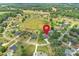 Aerial view of property in a pastoral neighborhood. Home features a large pool and fenced-in backyard at 4941 Campobello Dr, Monroe, NC 28110