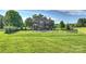 Large fenced backyard with a gunite pool, patio area with pergola, and large lawn at 4941 Campobello Dr, Monroe, NC 28110