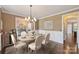 Elegant dining room with a chandelier, hardwood floors, and stylish decor for a cozy and inviting atmosphere at 4941 Campobello Dr, Monroe, NC 28110