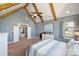Inviting main bedroom with exposed beams, a ceiling fan, neutral carpet and natural light from the window at 4941 Campobello Dr, Monroe, NC 28110