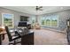 Spacious office with large windows offering views, a sizable desk, and office furniture at 4941 Campobello Dr, Monroe, NC 28110