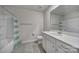 Bathroom with a shower/tub combo, gray floors, and a white vanity at 5034 Moss Pine Way, Tega Cay, SC 29708