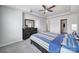 Bedroom with plush carpet, fan, and dresser at 5034 Moss Pine Way, Tega Cay, SC 29708