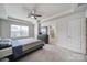 Bedroom with a ceiling fan and an attached bathroom at 5034 Moss Pine Way, Tega Cay, SC 29708