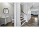 Hallway and half-bathroom featuring modern fixtures and wood-look flooring at 5034 Moss Pine Way, Tega Cay, SC 29708