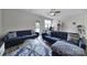 Spacious living room featuring comfortable seating, natural light, and backyard access at 5034 Moss Pine Way, Tega Cay, SC 29708