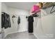 Walk-in closet with wire shelving filled with clothing and bags at 5034 Moss Pine Way, Tega Cay, SC 29708
